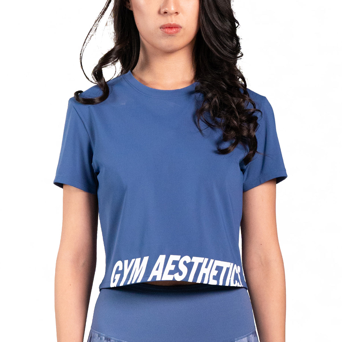 https://www.gymaesthetics.com/cdn/shop/products/activewear-cropped-fashion-t-shirt-women-mid-blue-ga21ssf023ftembl-7b.jpg?v=1689215569